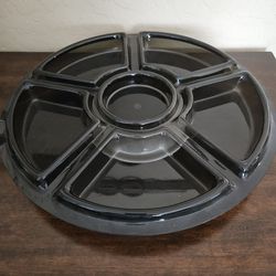 18" lazy Susan. 8 compartments, Rotates, Heavy Plastic, like new, Smokey grey 10.00