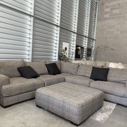 Large Dark Gray sectional + ottoman 