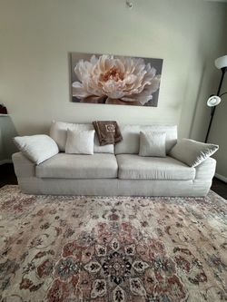 Light Gray Fabric Sofa with Cushions.