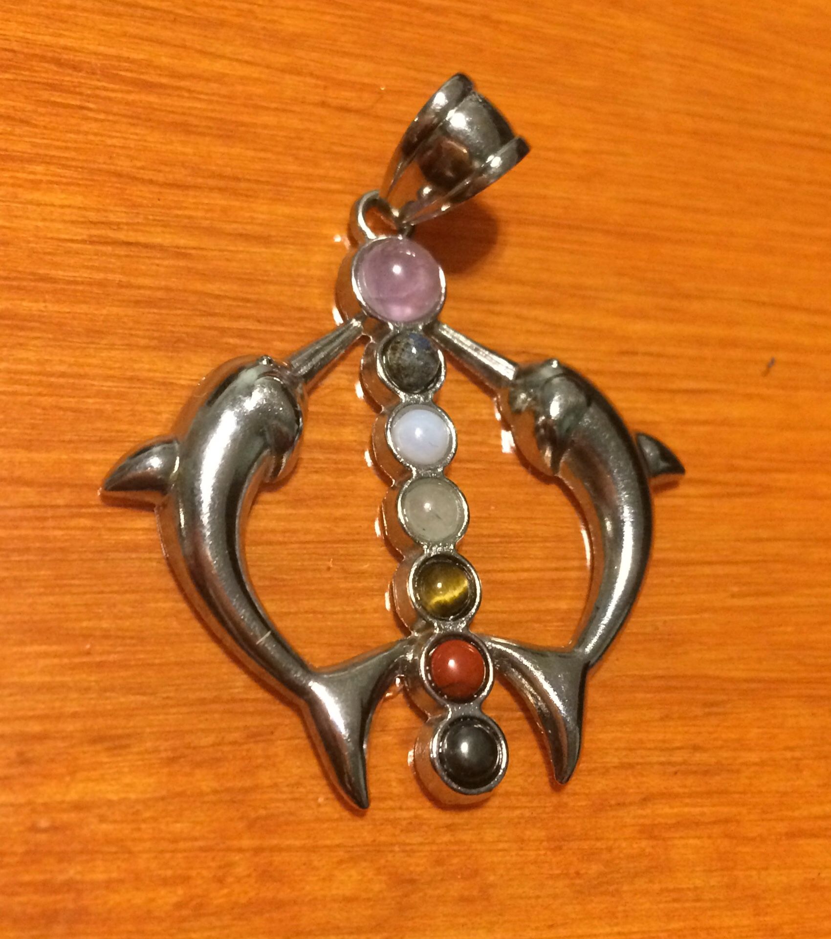 Silver dolphins with gemstones chakra pendant