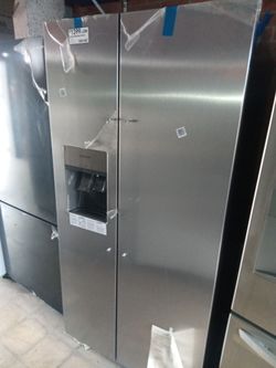 New Frigidaire stainless steel side by side refrigerator