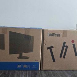 Two 27" monitors in original boxes with cables included.