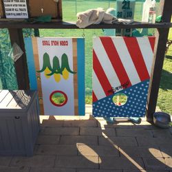 2 Decorated Solid Wood Corn Toss Boards.