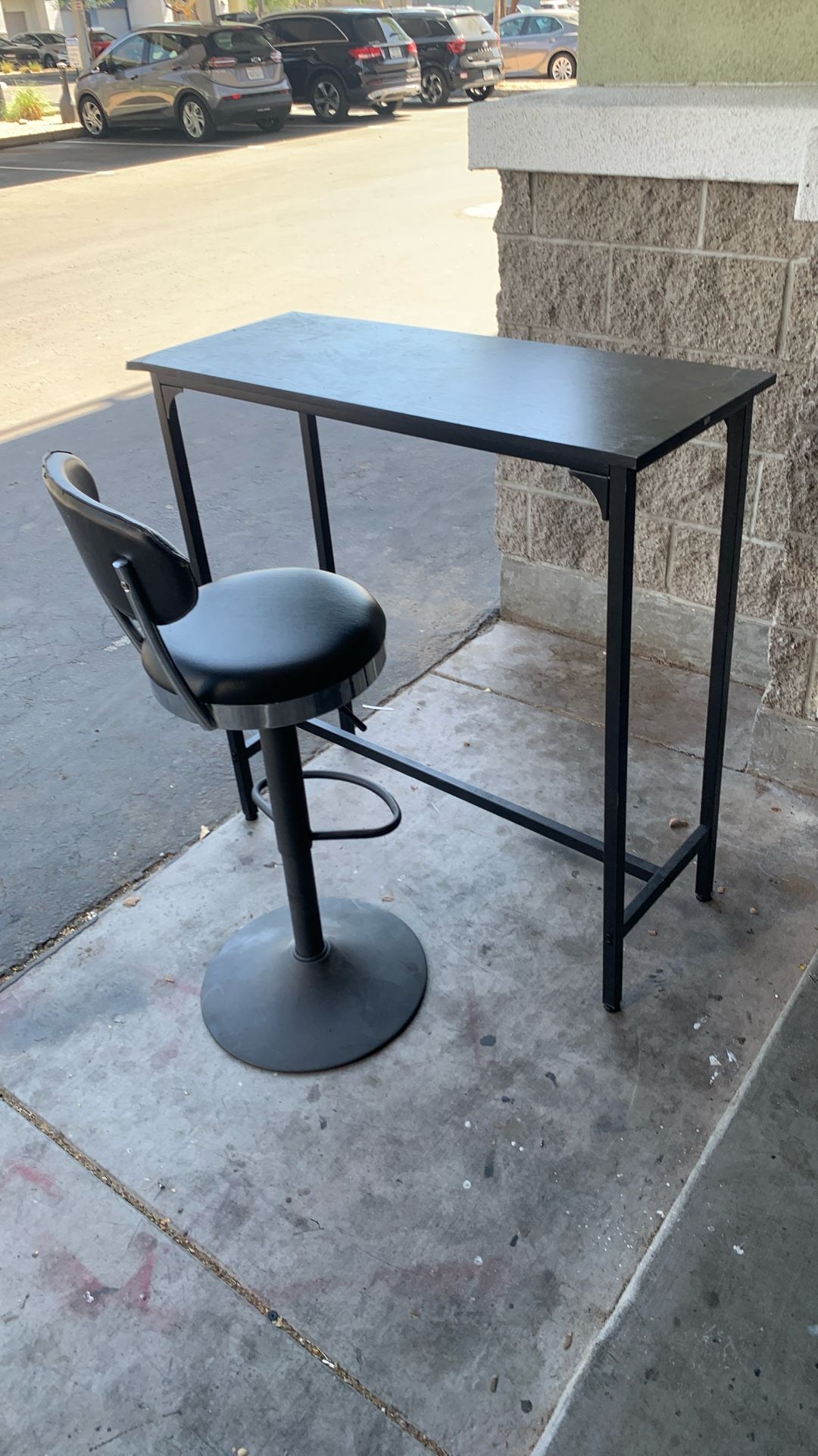 Bar height table with one stool