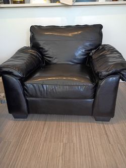 Black single seater sofa