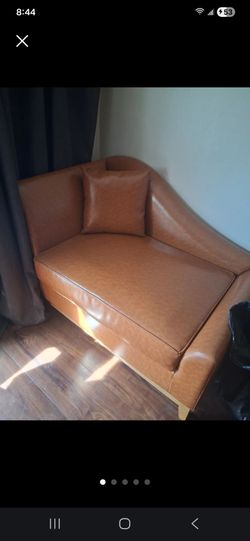 Almost new Leather 2 seater sofa with pillow