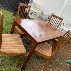 A Set Of Wooden Table , And Four Strong, Antique Chairs (the Table Top Needs A Little Cleaning)