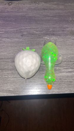Strawberry squishy in the sun it’s purple and mini duck