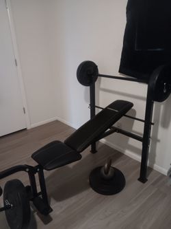 Competitor brand Weight bench,  weights, and bar