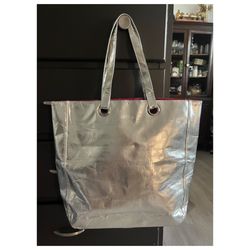 Clinique Silver metallic tote bag with pink lining