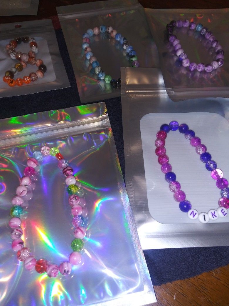 Nike. Pink. Bracelets