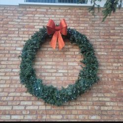 50 inch artificial LED light up wreath. I will also throw in a 24 inch artificial wreath for free.