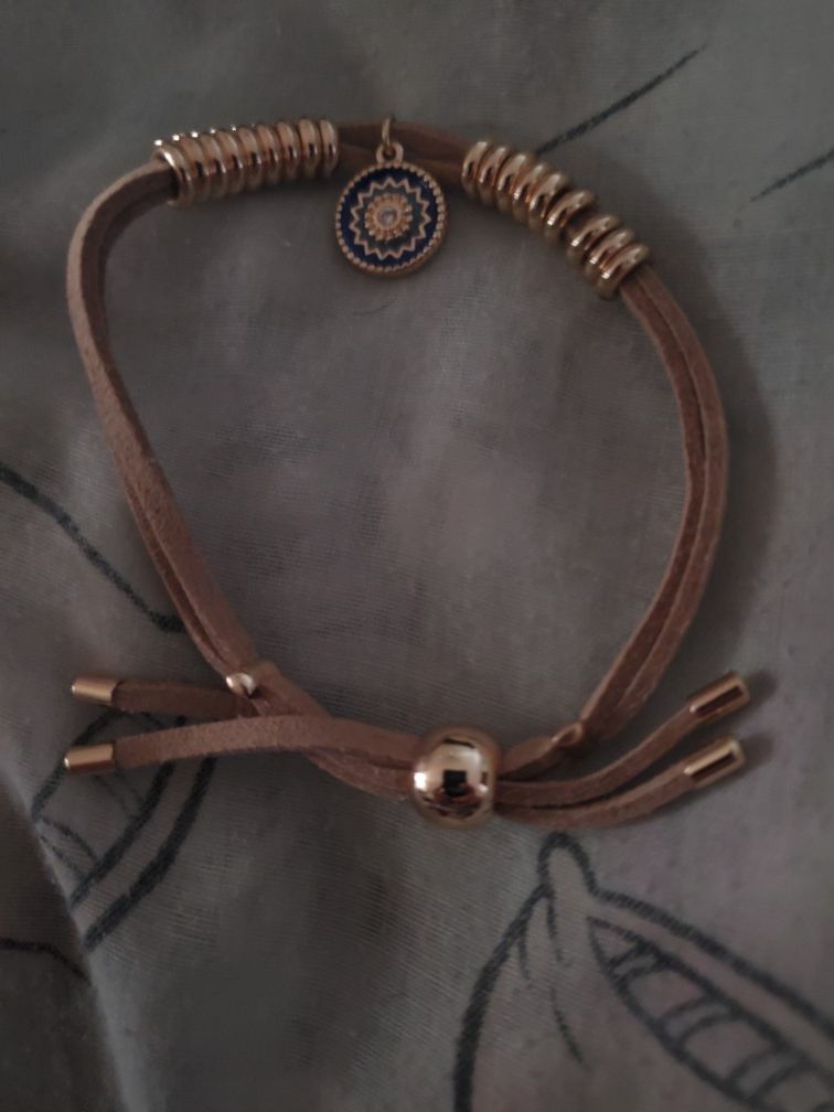 Symbolic charm cord bracelet