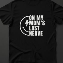 "On My Mom's Last Nerve" T-Shirt
​This is a classic-fit crew neck t-shirt in black, featuring a bold, graphic print in white.
​Design Focus: The shirt