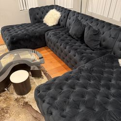 Stunning contemporary coffee table from rental property. Excellent condition! Features: 	∙	Unique S-shaped tempered glass top 	∙	Dark wood/espresso fi