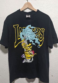 Black Warren Lotas x Los Angeles Lakers Kobe Bryant graphic tee features a signature skeletal illustration dissolving into blue smoke
Size Large 
On a