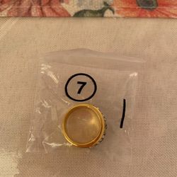 Elegant Gold-Tone Band Ring with Clear and Blue Gemstone Accents