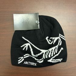 Black and grey Arcteryx beanies