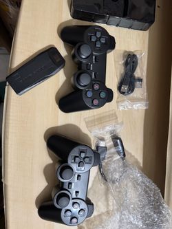 New Game Stick Lite console has two 2.4G wireless controllers. Includes charging cables, supports 4K Ultra HD with classic games.