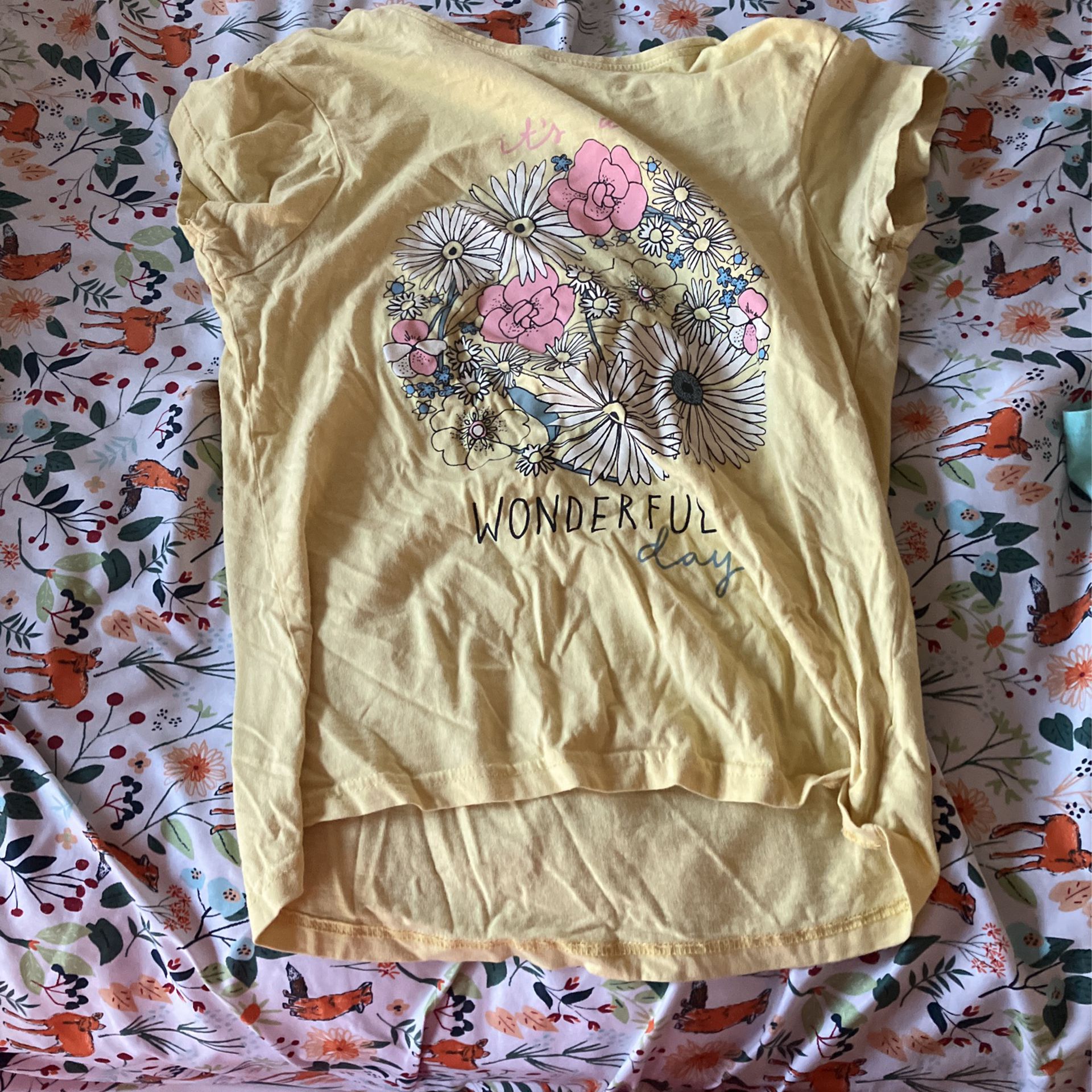 Yellow Short Sleeved Short With Blue, Black, Yellow And Baby Pink Flowers With “it’s Wonderful Day” On The Shirt 
