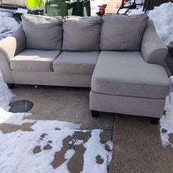 Gray Sofa With Foot Resting