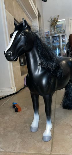Black toy horse with mane and tail