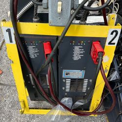 (2) 24v battery chargers for forklift or pallet jack model #SVR(contact info removed)5/6 with 25amps There’s 2 same chargers in one yellow metal prote