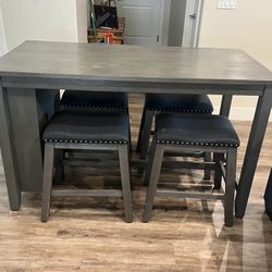 Caitbrook Counter Height Dining Table and 4 Barstools