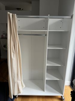 white wooden wardrobe / armoire