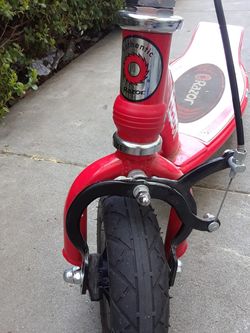 Razor E100 Motorized 24 Volt Battery Electric Powered Kids Ride-On Scooter, Red