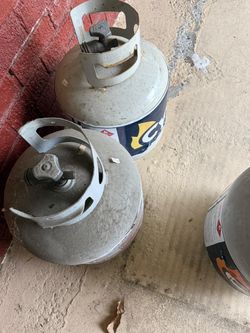 Propane Gas tanks  – 1 full and sealed   2 half full and 2 empty.  (   5 total)