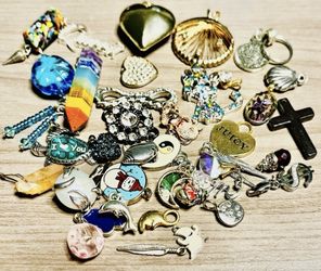 Vintage Pendants and trinkets. These pendants and trinkets are small. As is. No returns. What you see is what you get. Make me an offer I can’t refus