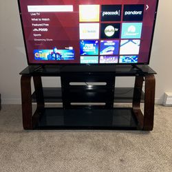 Elegant Entertainment stand and 55” smart TV duo