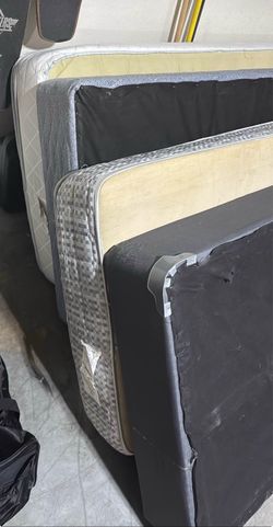 2 twin beds with mattresses and box spring