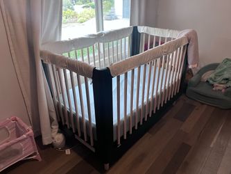 Beautiful black Used crib. No structural issues but paint chipped on top