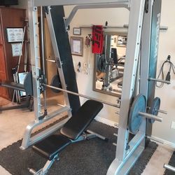 Smith Machine + Adjustable Bench + 4 Olympic Weight Plates