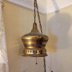 Moroccan brass hanging lamp with chain.