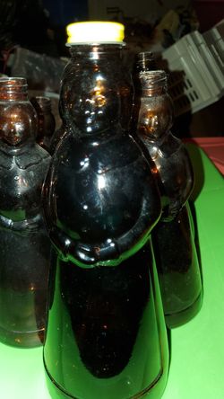 Vintage large syrup bottle with yellow metal cap