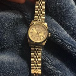 Rolex Lady-Datejust with a stainless steel case, white gold fluted bezel, and a Jubilee bracelet. 