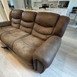 Full Size Leather Sofa With A Recliner On Each End