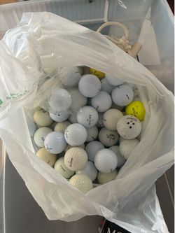 60+ golf balls.     All in very good condition