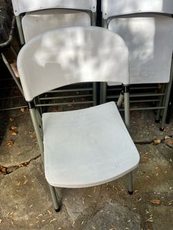 Folding white chairs