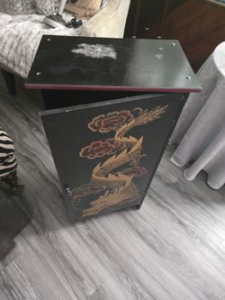 Asian cabinet with 2 shelves. Length 16"  depth 9 1/2 height 30"