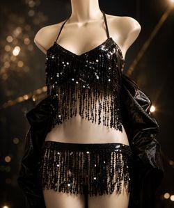 Elegant and captivating, this black sequin lingerie set is designed to make a bold fashion statement. Featuring shimmering fringe details and a sleek 