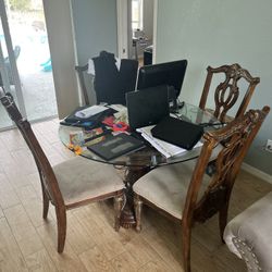Circular dining table with four chairs