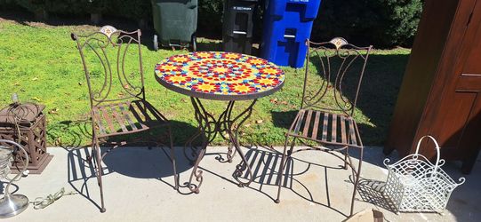 Cast iron table w/ two chaira