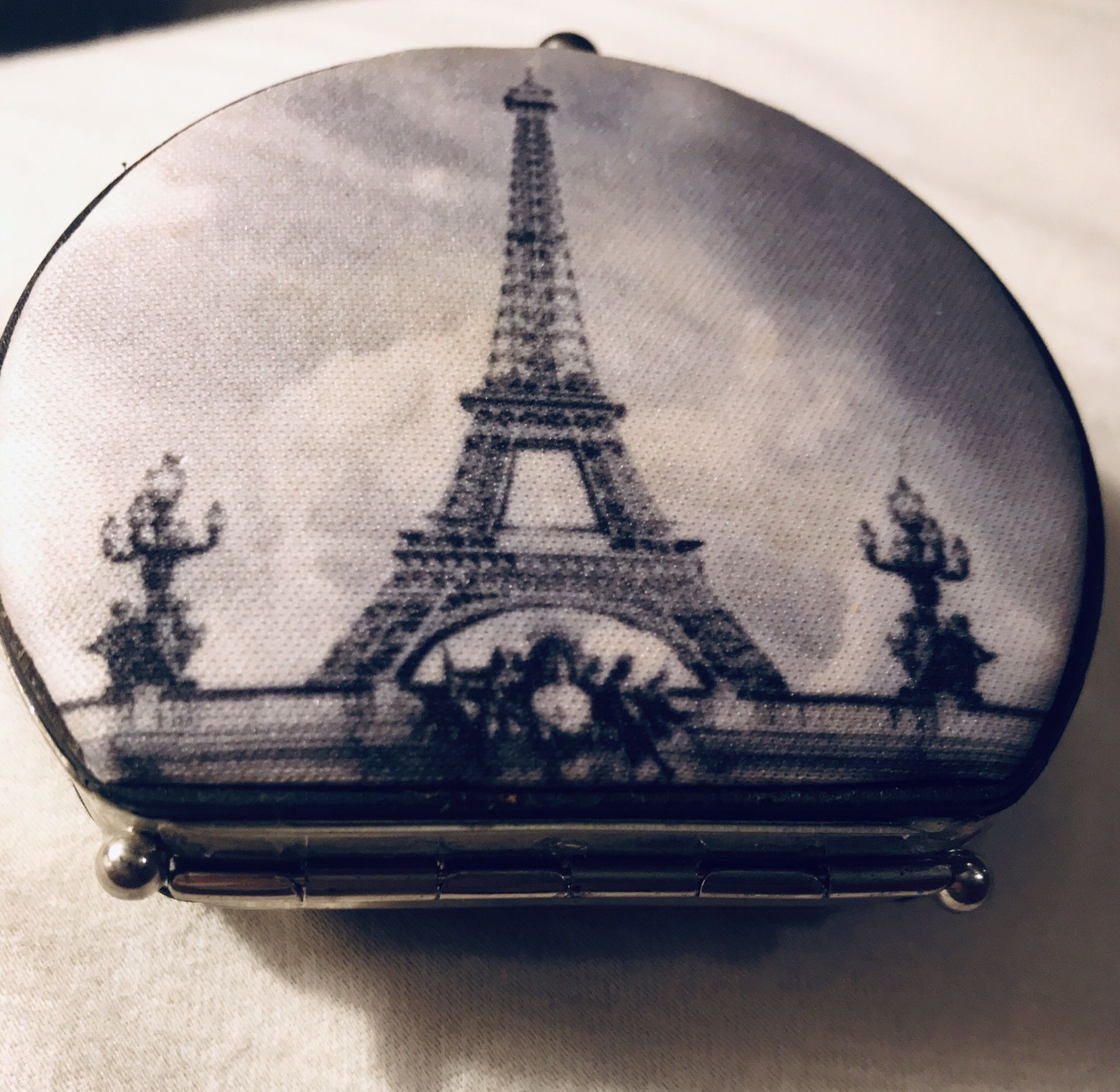 Vintage antique mirror compact of the Eiffel Tower