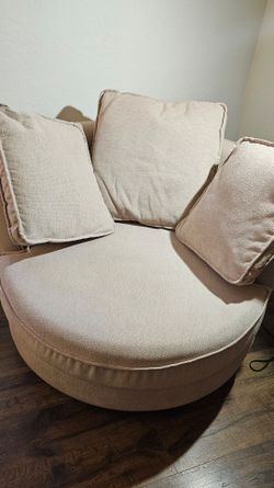 Light pastel pink large swivel barrel sofa chair