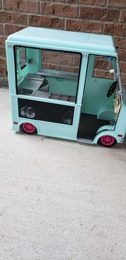 an Our Generation Sweet Stop Ice Cream Truck with a light blue exterior
