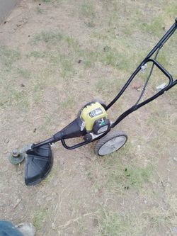 Ryobi T430 4-Cycle Wheeled String Trimmer.